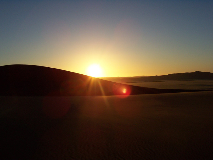 A spectacular sunset over the dunes in the Namib Desert