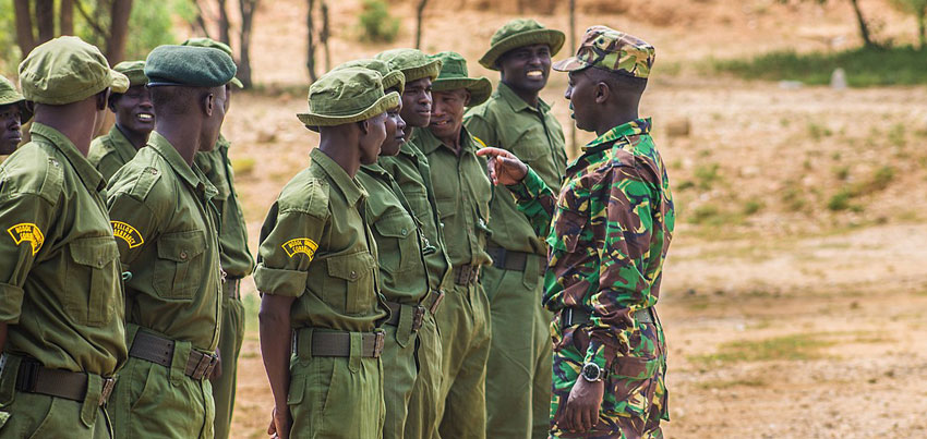 Instructor having a word with Community rangers during a training exercise. Copyright Wikipedia