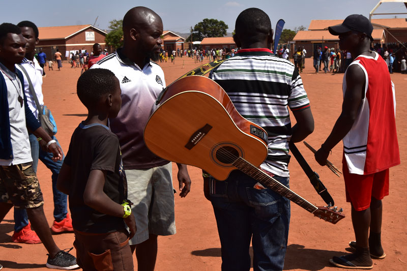 An artist mingling with the crowd at the festival